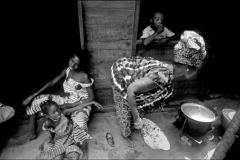 SENEGAL. Dakar. Family cooking and relaxing outside their hut. 1970.