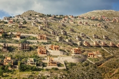 MONDELLO, SICILY, ITALY - JANUARY 21, 2011: abandoned buildings at Pizzo Sella. Not far from Palermo. The buildings have been embargoed by the local Court for almost 2 decades, after a dispute between ambientalists and a local promoter. The story of the houses in Pizzo Sella, begins in 1978, when the Sicilcalce spa - a company close to the then boss of Cosa Nostra Michele Greco got 314 building permits. This is just another "ecomonster" in the Mediterranean coasts. A curse that has hit all the P.I.G.S. and is still difficutl to fight against, because of very rooted political corruption, and links between politicians and the mafias. Photo by Carlos Spottorno / Getty Images
