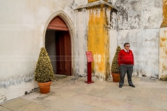 SINTRA, PORTUGAL - MAY 16 2013: a guard at the entrance of the National Palace of Sintra displays self confidence. and authority. In a culture where hierarchy is still pertinent , being the master of your own square meter is more relevant that one might think. Everyone tends to protect their own area of influence, as a very precious asset. As a photographer, I have experienced the capriciousness of security guards many times. This is my tribute to them.
