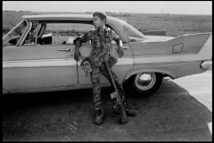 SOUTH VIETNAM. Near My Tho. 1972. A soldier of the South Vietnamese army leans on an American car.